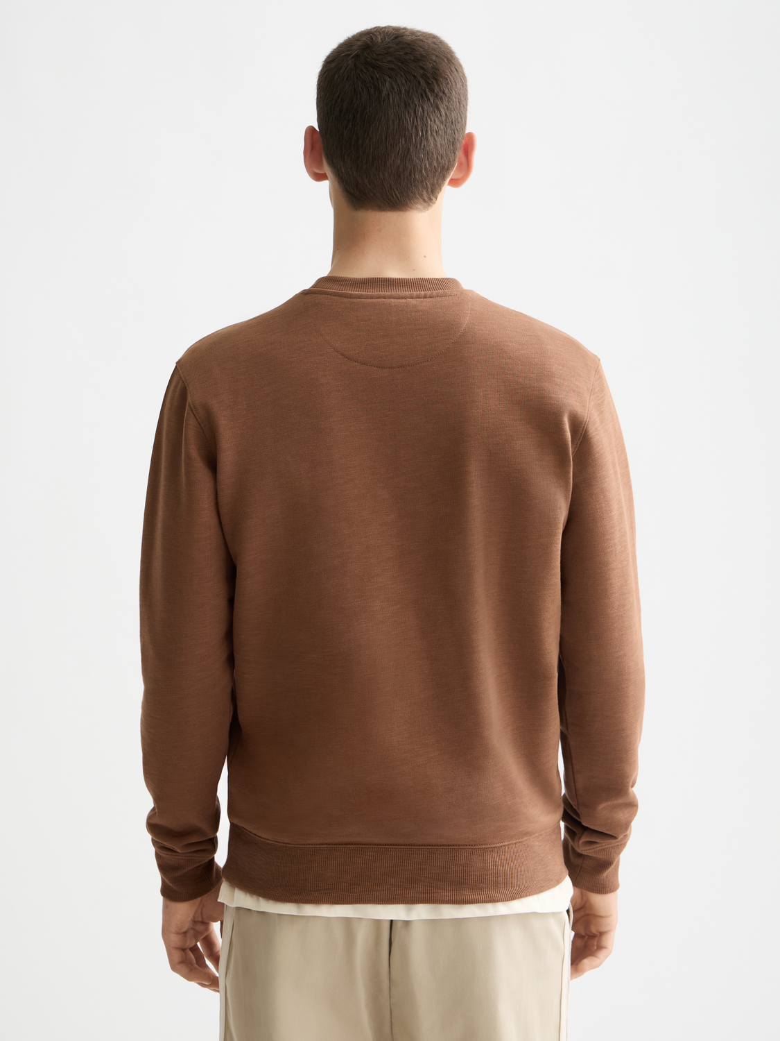 Black Scotch & Soda chest logo sweatshirt with a relaxed fit and ribbed cuffs, displayed on a plain background.