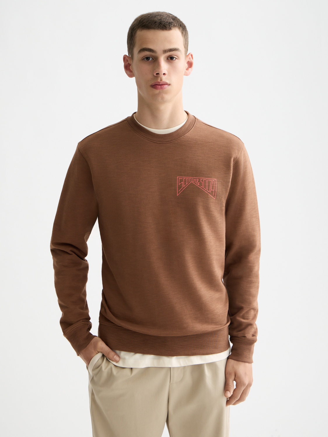 SCOTCH & SODA chest logo sweatshirt showing a cozy gray sweatshirt with a front logo design and ribbed cuffs and hem.
