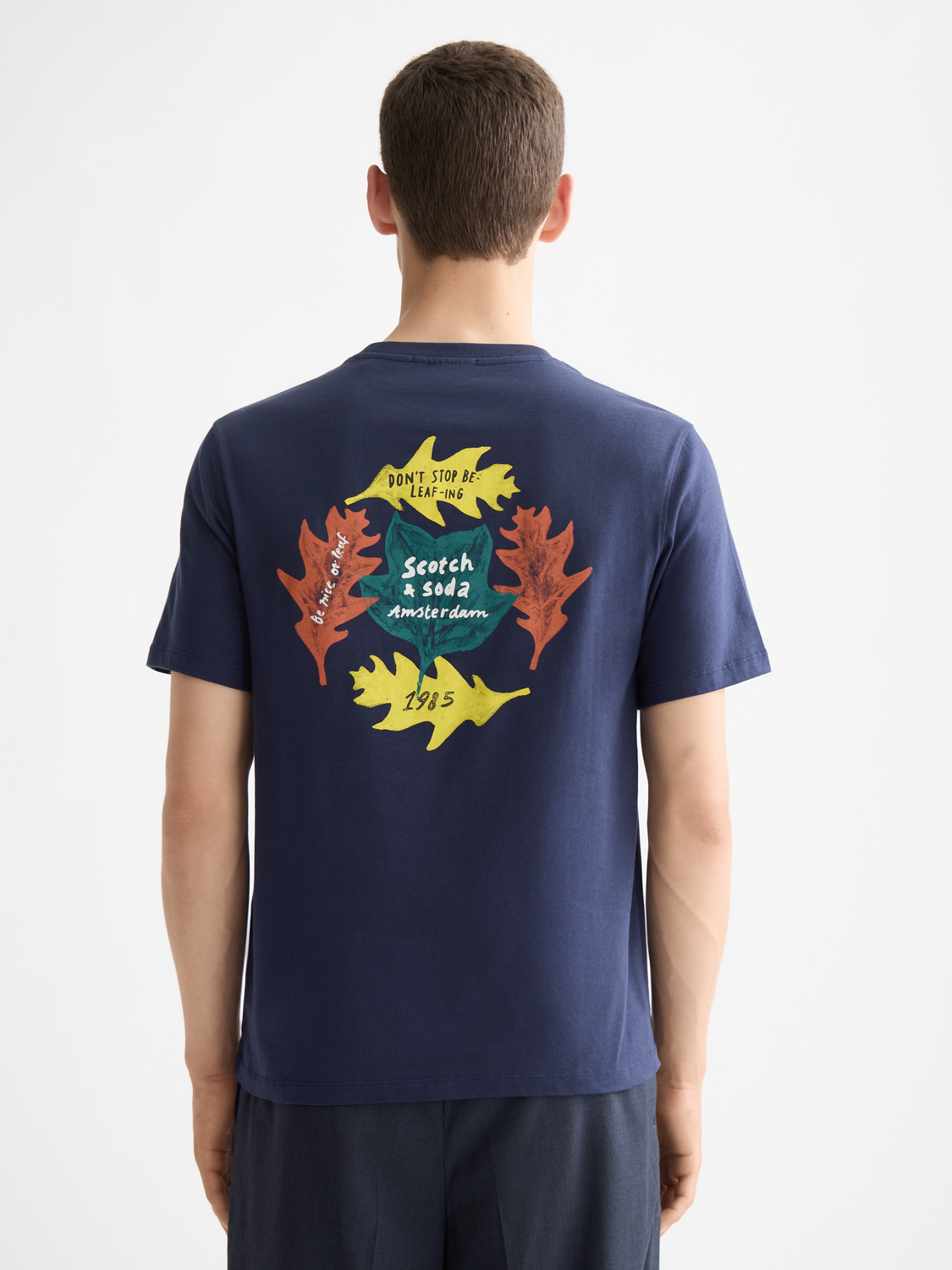 SCOTCH & SODA artwork short sleeve t-shirt featuring a colorful printed design on black fabric.