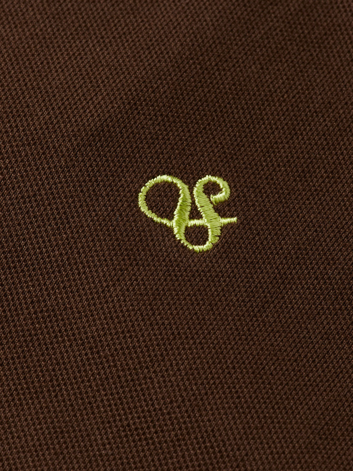 Men's regular-fit polo shirt by Scotch & Soda, in a classic style with a collar and short sleeves, shown in a detailed close-up.
