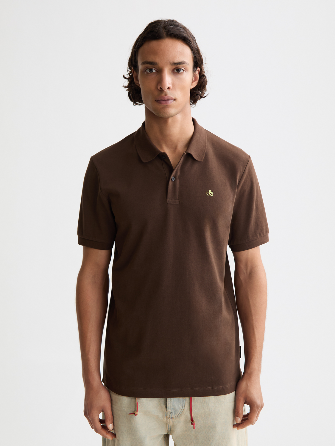 Regular-fit Scotch & Soda polo shirt displayed in navy with a classic collar and short sleeves, crafted from soft cotton fabric.