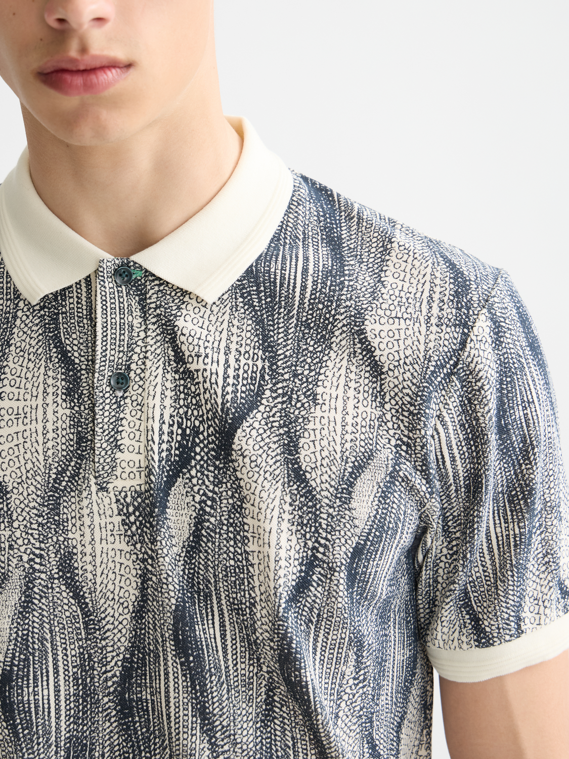 Printed polo shirt by SCOTCH & SODA featuring a stylish design and classic collar, displayed on a plain background.