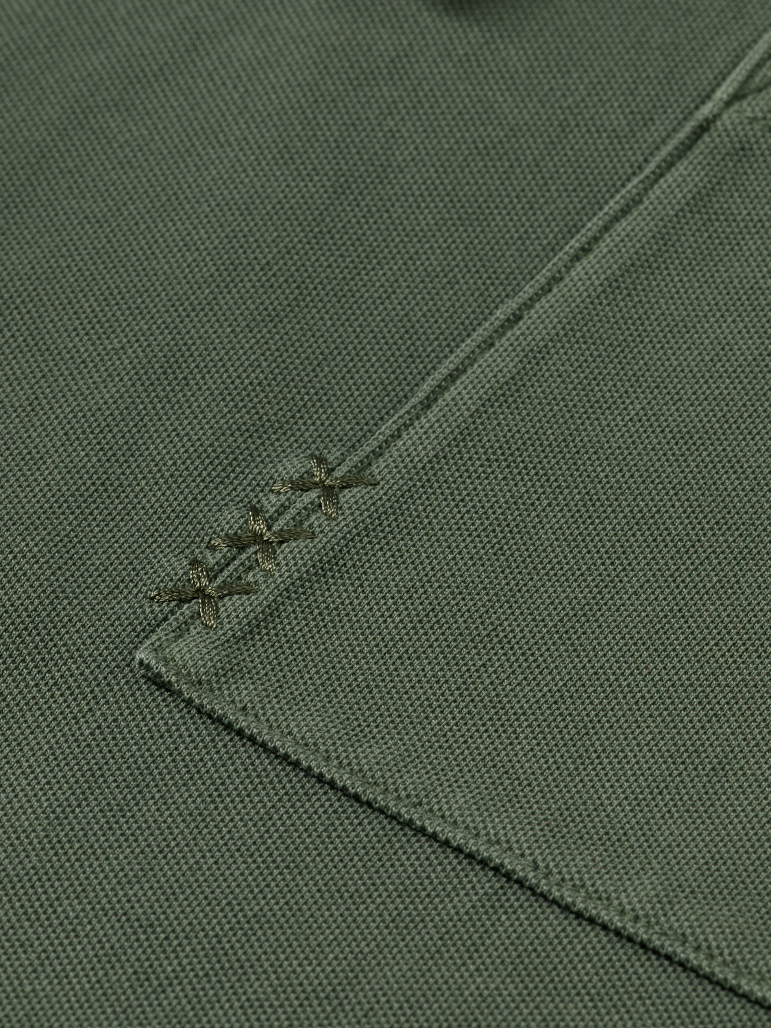 Scotch & Soda men's pique polo shirt in navy with collar and short sleeves, made from textured cotton fabric.