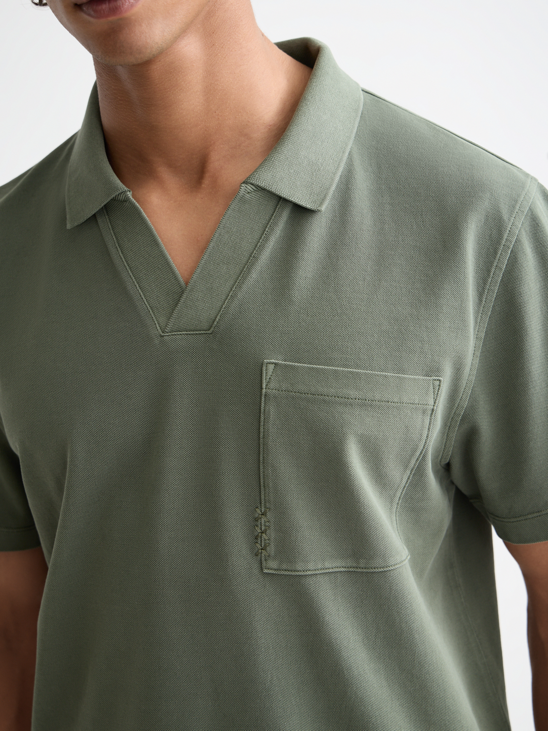 Navy Scotch & Soda pique polo shirt with a classic collar and short sleeves, displayed flat on a white background.