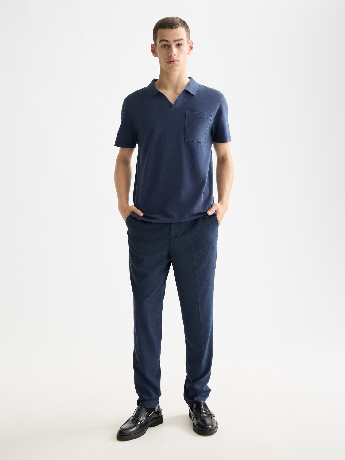 Navy Scotch & Soda pique polo shirt with a classic collar and short sleeves, displayed flat on a white background.