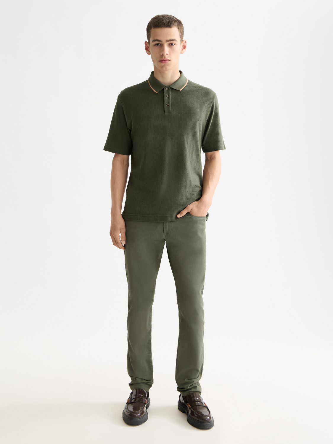 Structured blue polo shirt from Scotch & Soda, featuring a classic fit and collar, displayed on a hanger.
