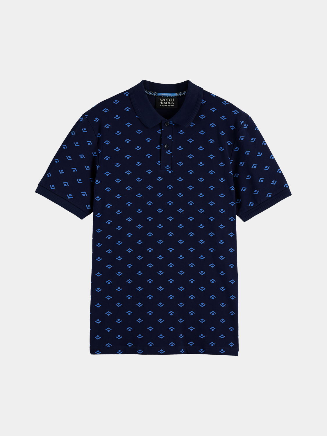 Printed Scotch & Soda polo shirt with colorful pattern, short sleeves, and classic collar, displayed on a hanger.