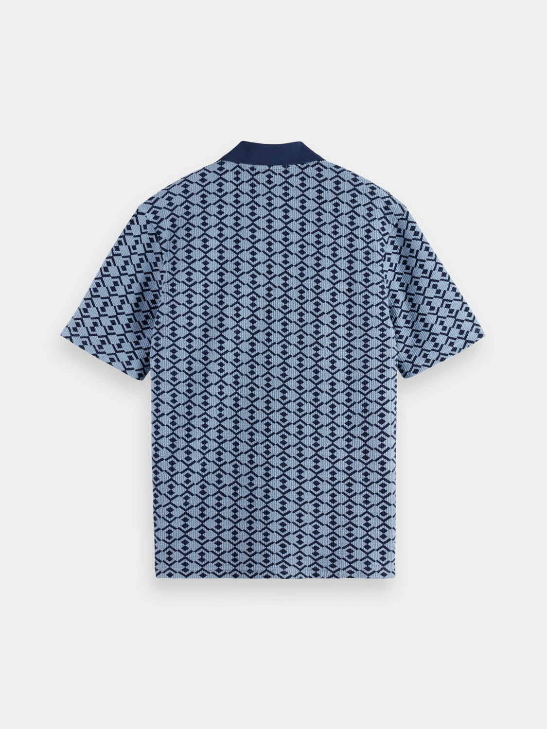 Black towelling polo shirt by Scotch & Soda, featuring a classic polo collar and short sleeves.