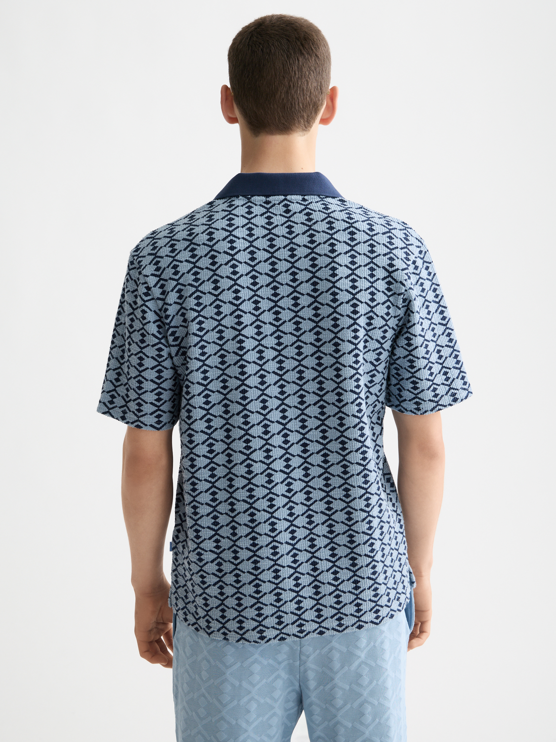Scotch & Soda towelling polo shirt with a classic fit, featuring a collar and short sleeves in soft terry fabric.