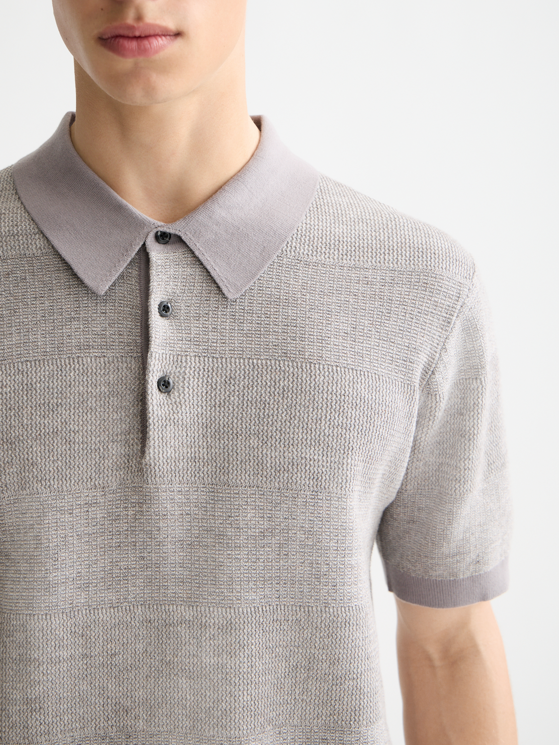 Knitted tonal striped polo shirt by Scotch & Soda featuring a classic collar and short sleeves.