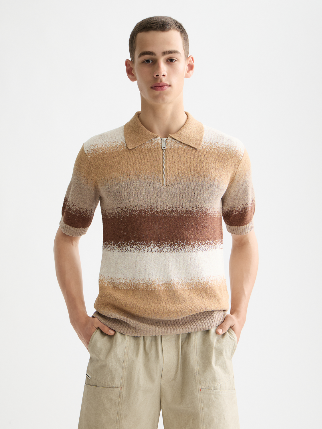 Knitted gradient polo shirt by Scotch & Soda, featuring a colorful ombre design and classic polo collar.