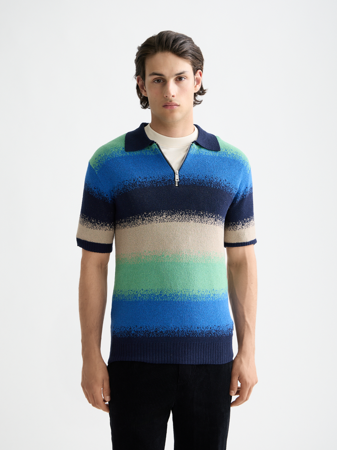 Knitted gradient polo shirt by Scotch & Soda showing a close-up of the front with a colorful, textured design.