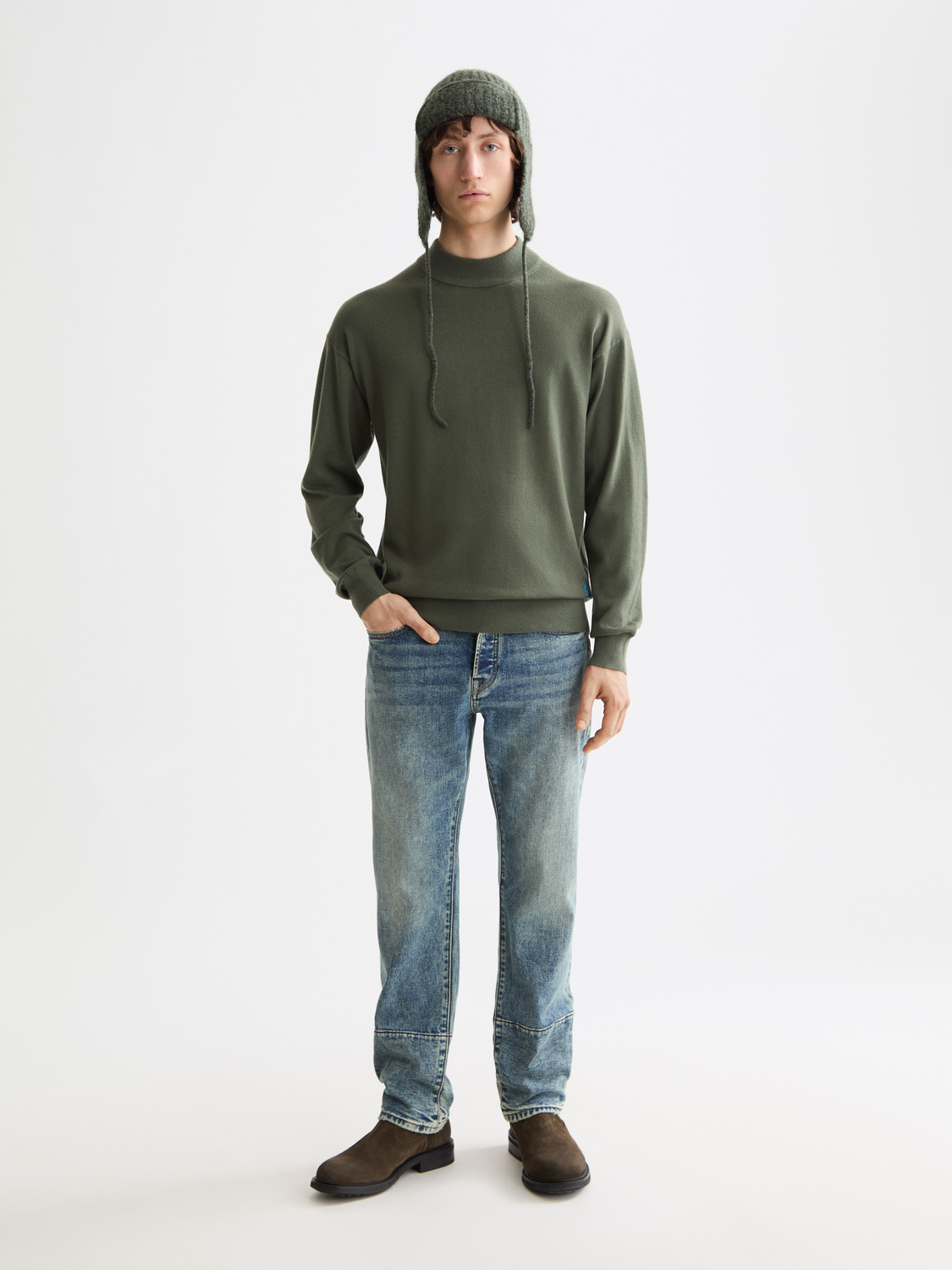SCOTCH & SODA knitwear mock neck pullover in a neutral color, featuring a close-up of the fabric and neckline detail.