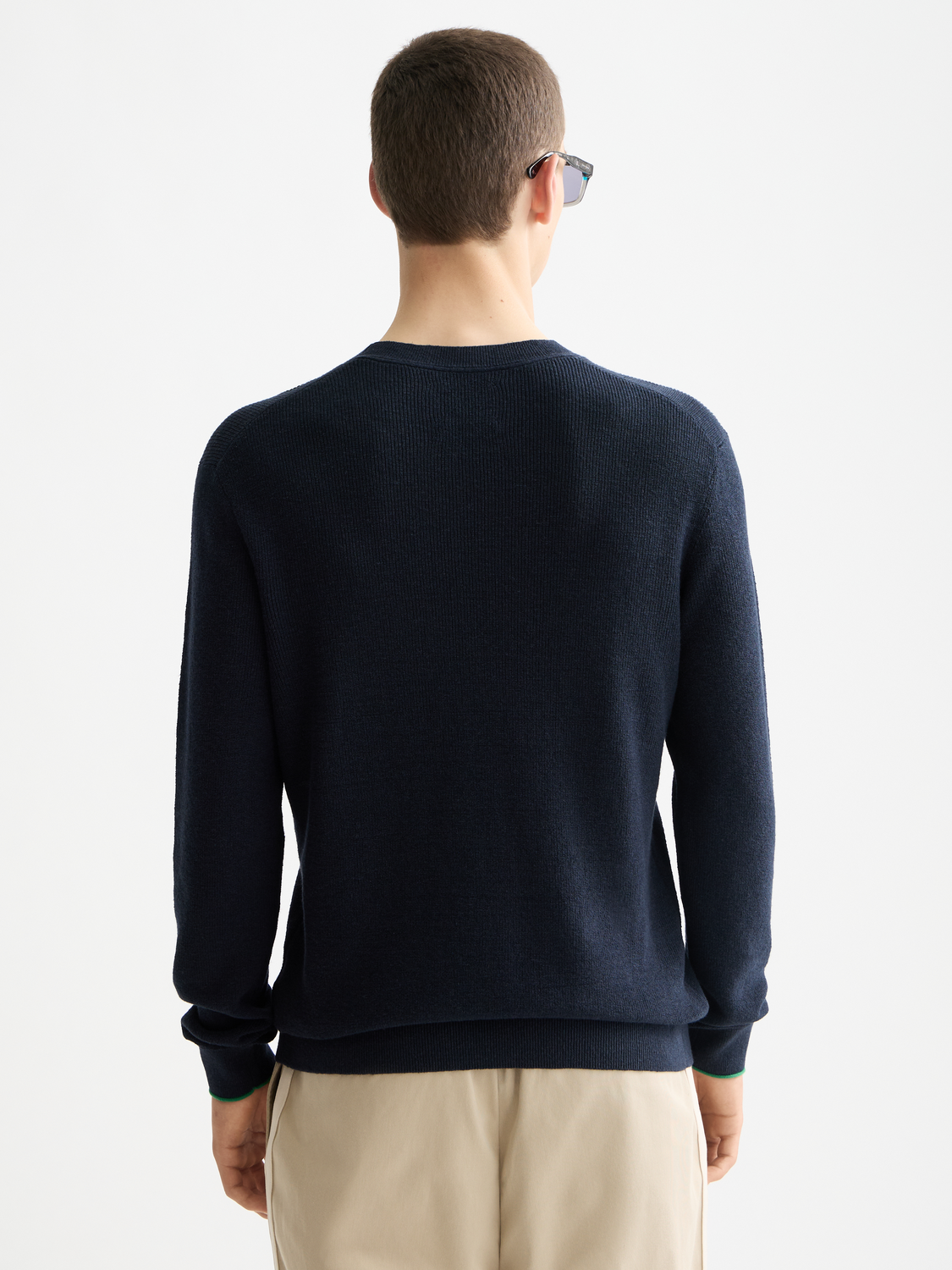 Dark blue Scotch & SODA crewneck pullover knitwear with ribbed cuffs and collar, displayed flat against a white background.