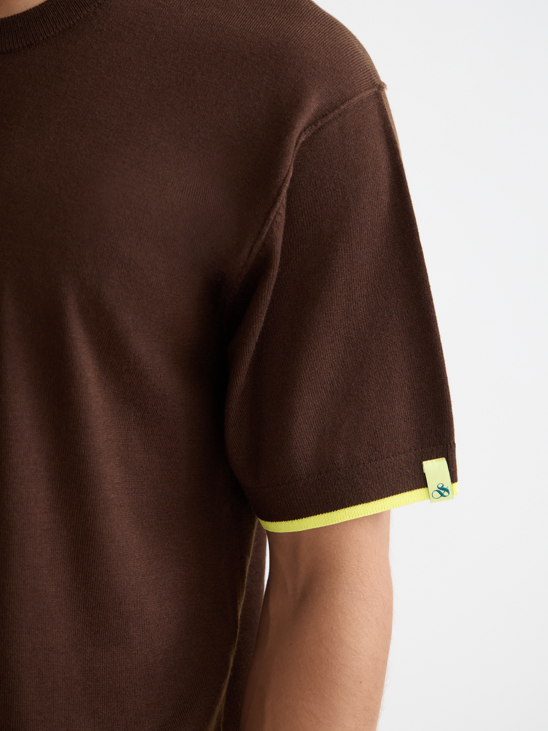 Knitted T-shirt from Scotch & Soda, cozy knitwear with a textured design, casual fit, and ribbed collar for a stylish look.