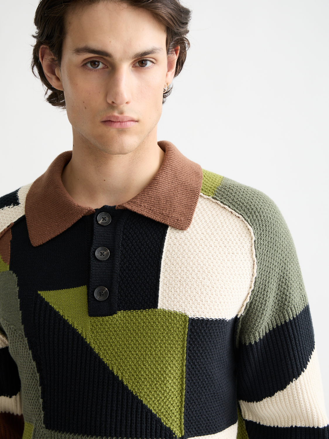 Patchwork long-sleeved polo knitwear by Scotch & Soda featuring multicolor patchwork design and classic collar.