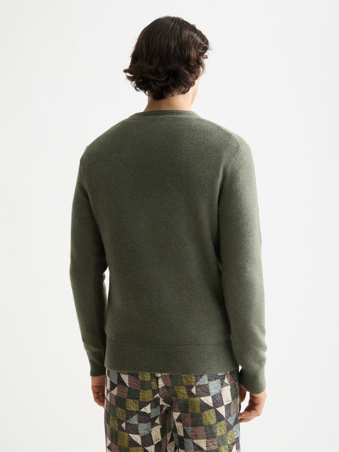 Soft knit pullover by Scotch & Soda, featuring a cozy knitwear design with a relaxed fit and ribbed collar, shown from the back.