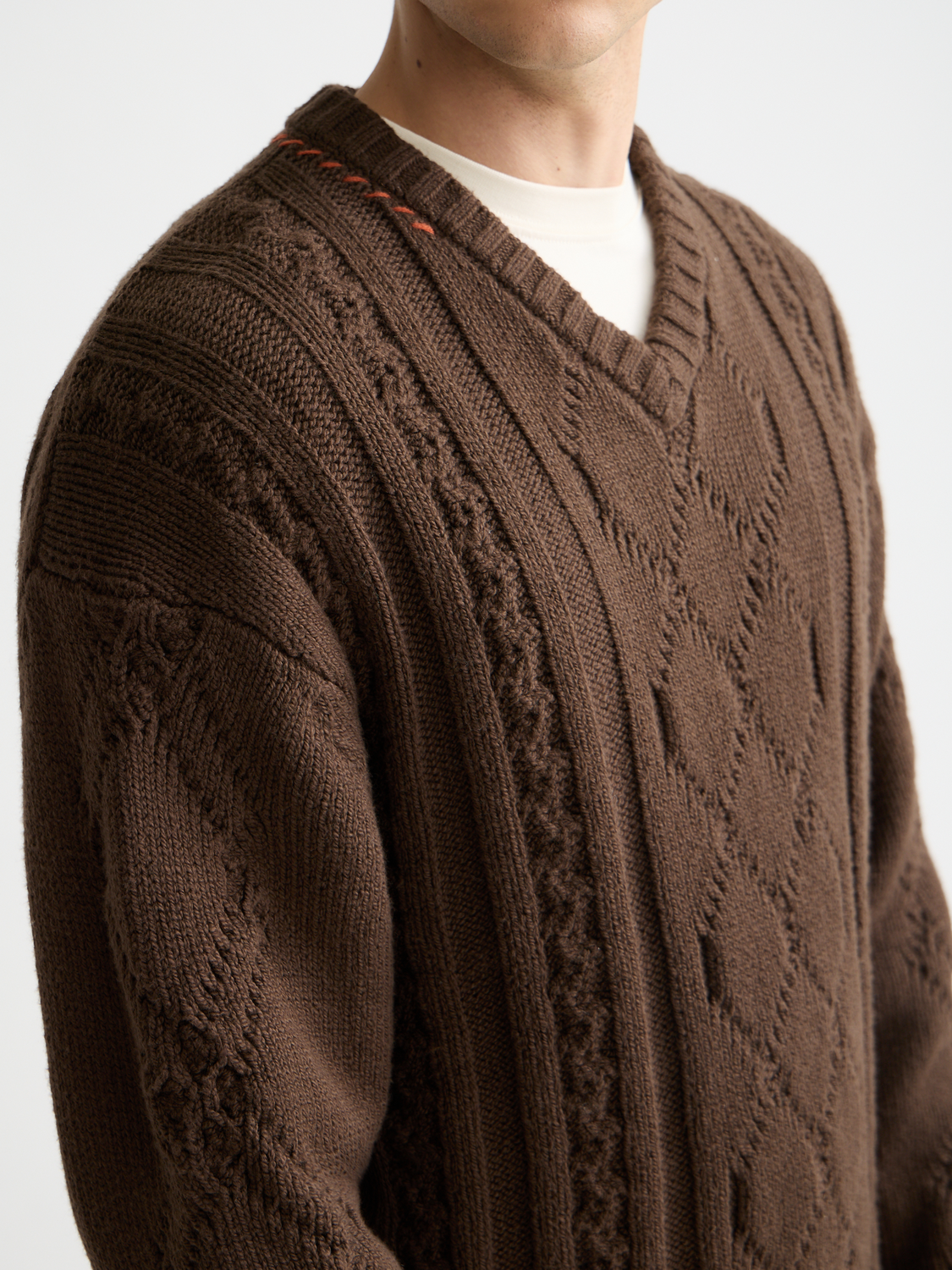 SCOTCH & SODA V-neck knitwear pullover in soft fabric, shown on a model with a neutral background.