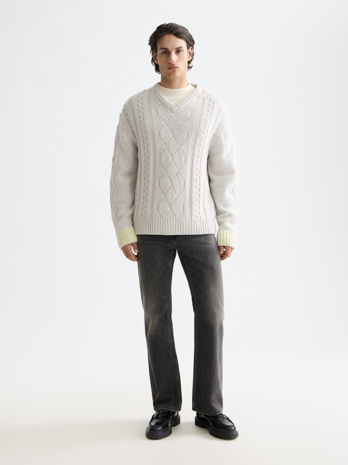 SCOTCH & SODA V-neck knitwear pullover in a classic design, shown in a close-up of the fabric and neckline.