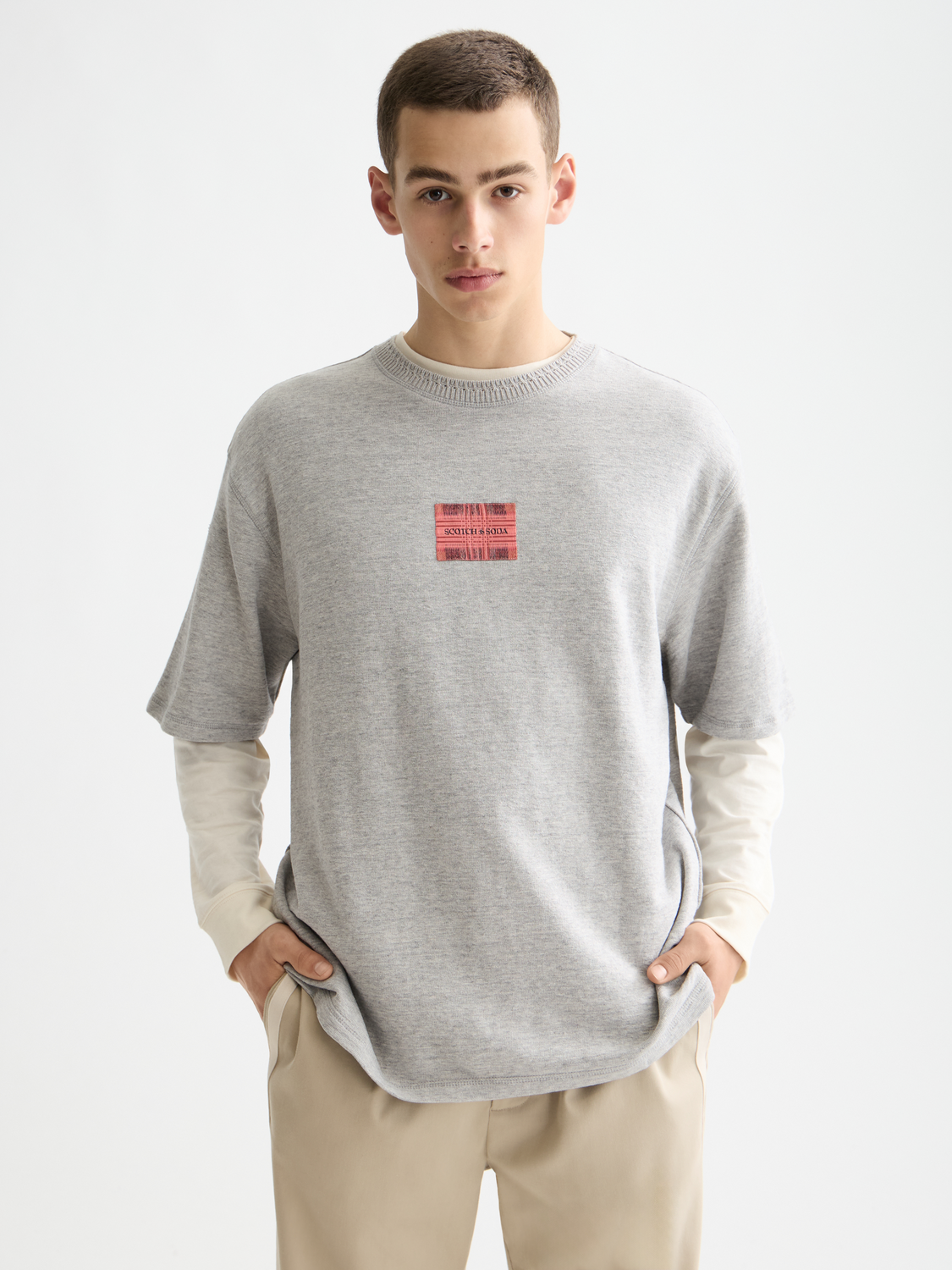 Light blue SCOTCH & SODA label T-shirt with short sleeves and front graphic design.