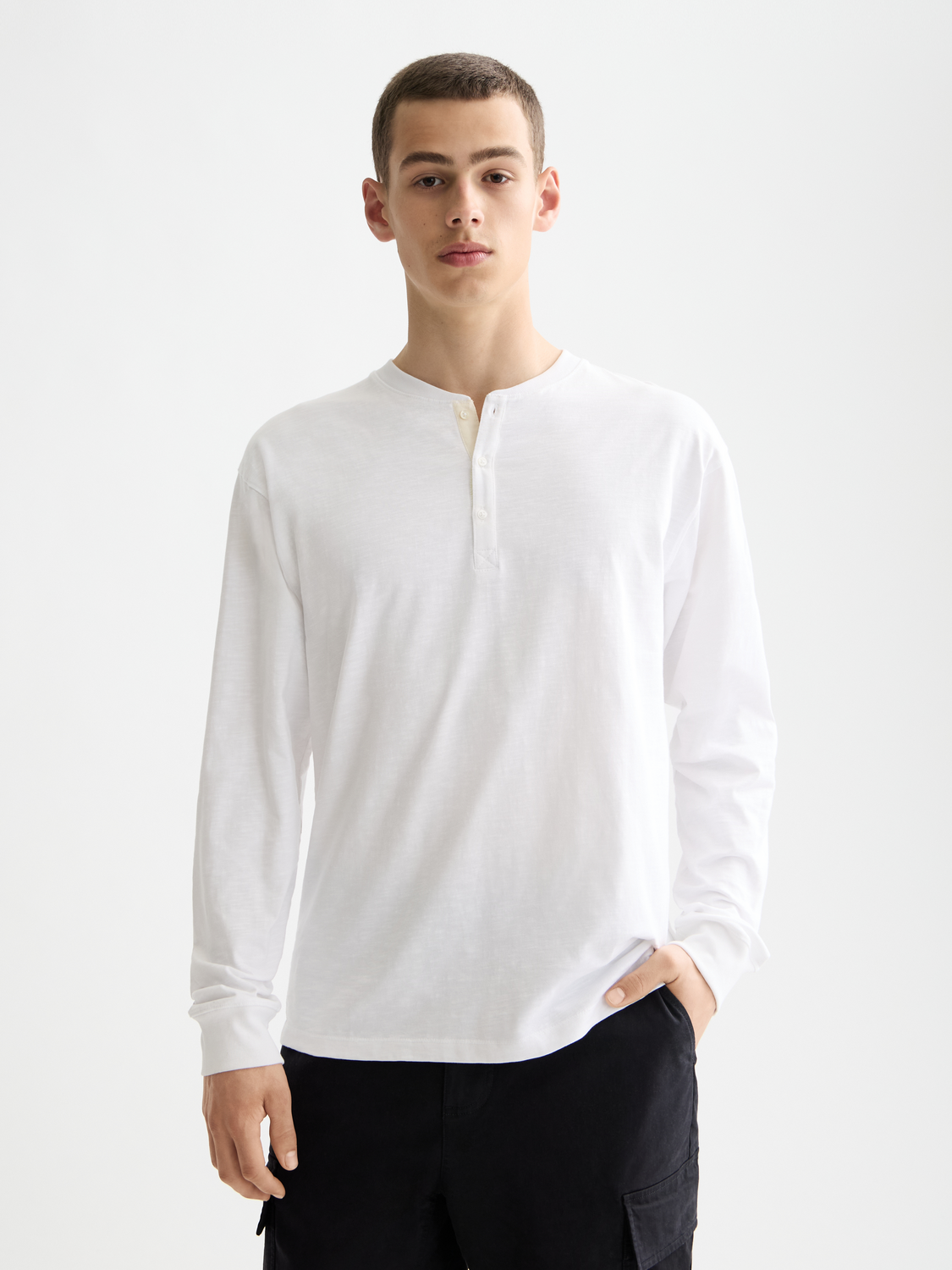 Long sleeve Slub Henley t-shirt by Scotch & Soda with a buttoned neckline and textured fabric, shown in a close-up front view.