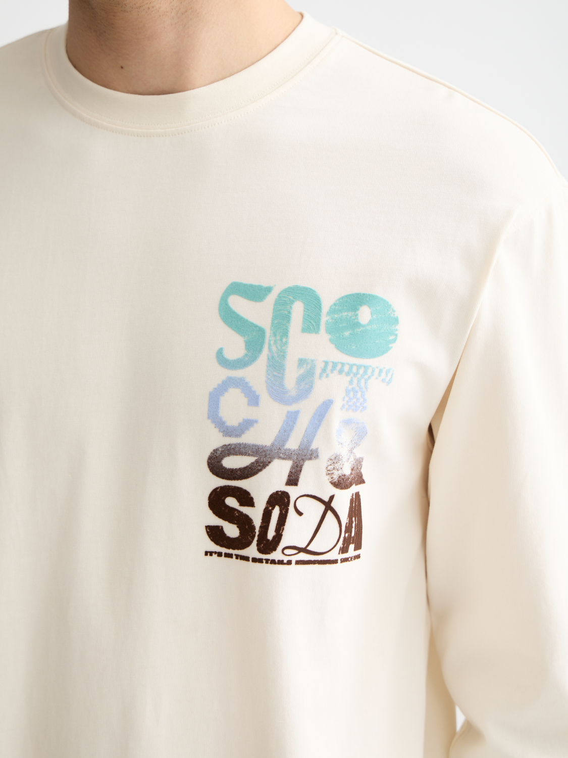 Long-sleeved Scotch & Soda artwork t-shirt with colorful graphic design on a casual fit, displayed on a plain background.