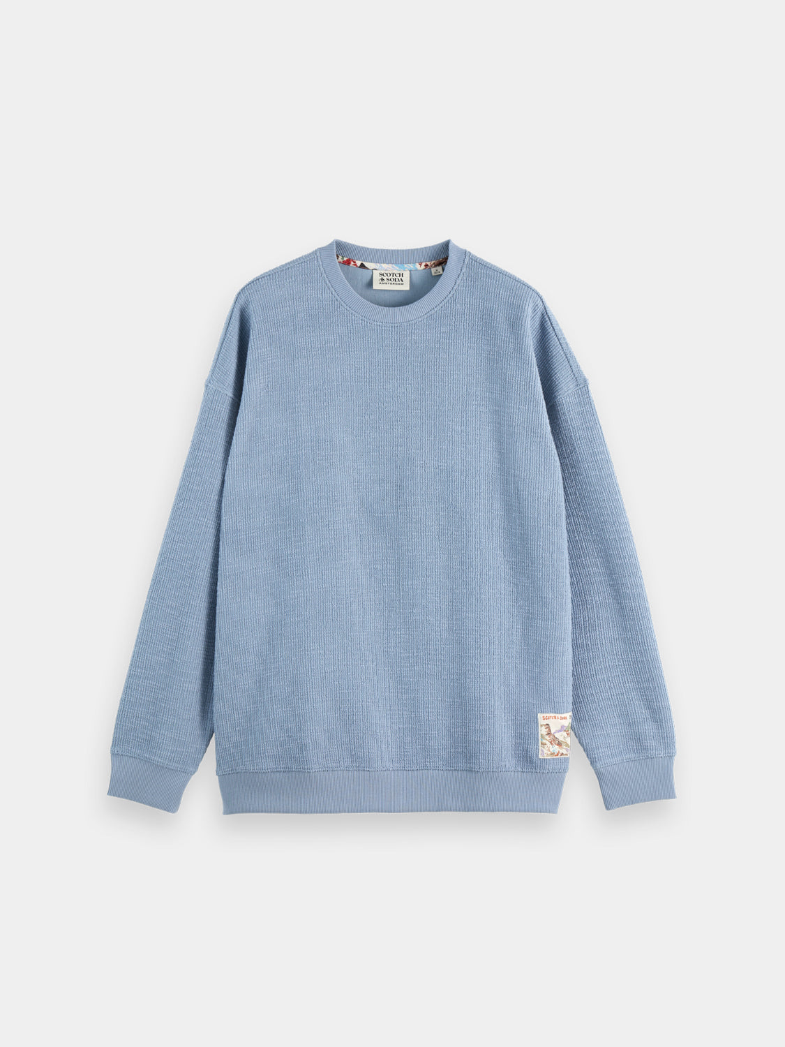 Textured sweatshirt from SCOTCH & SODA, casual sweats with a soft, patterned fabric and ribbed cuffs on a plain background.