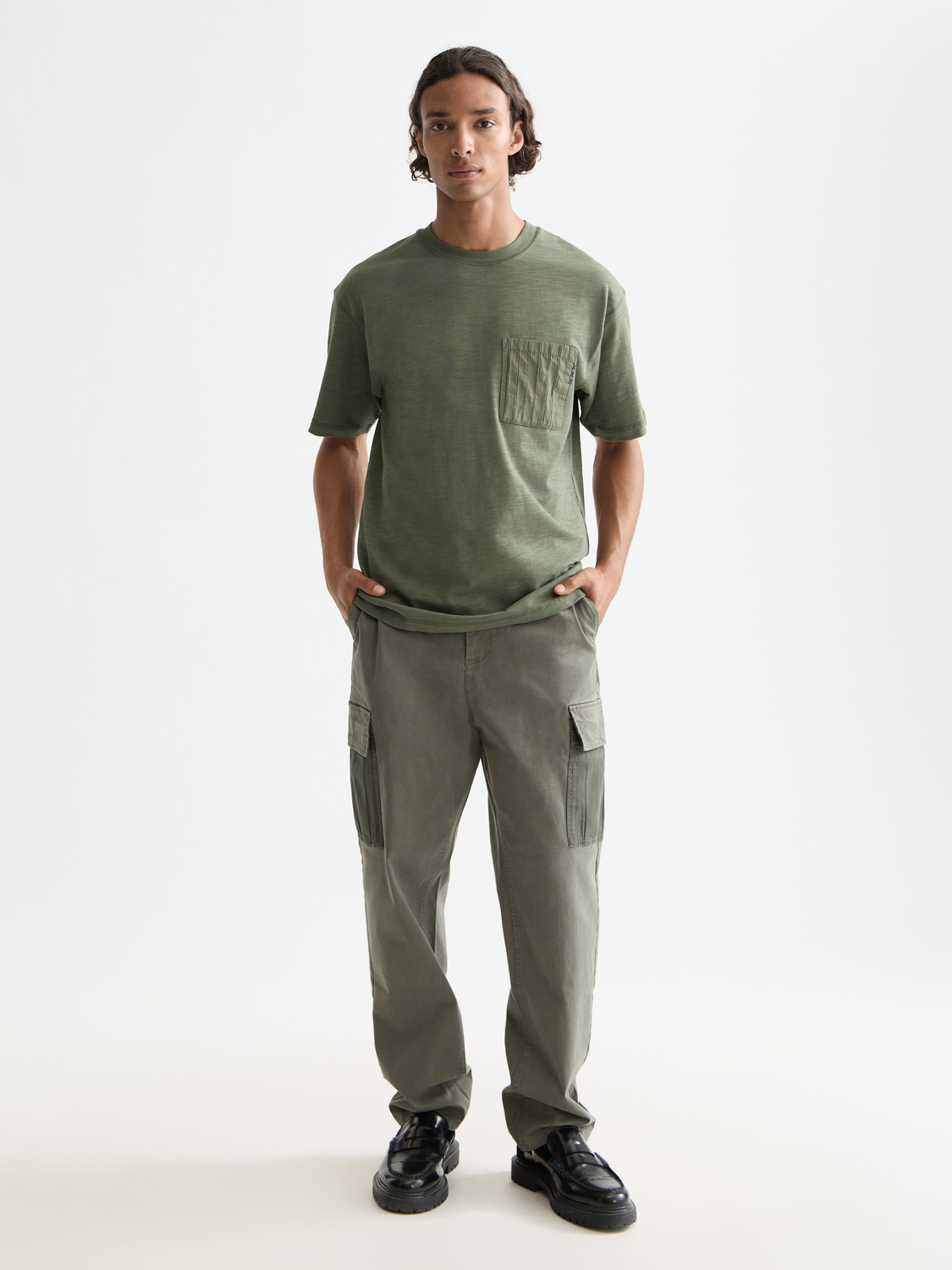 Patchwork pocket t-shirt by Scotch & Soda, short sleeve tee with colorful patchwork design and front pocket detail.