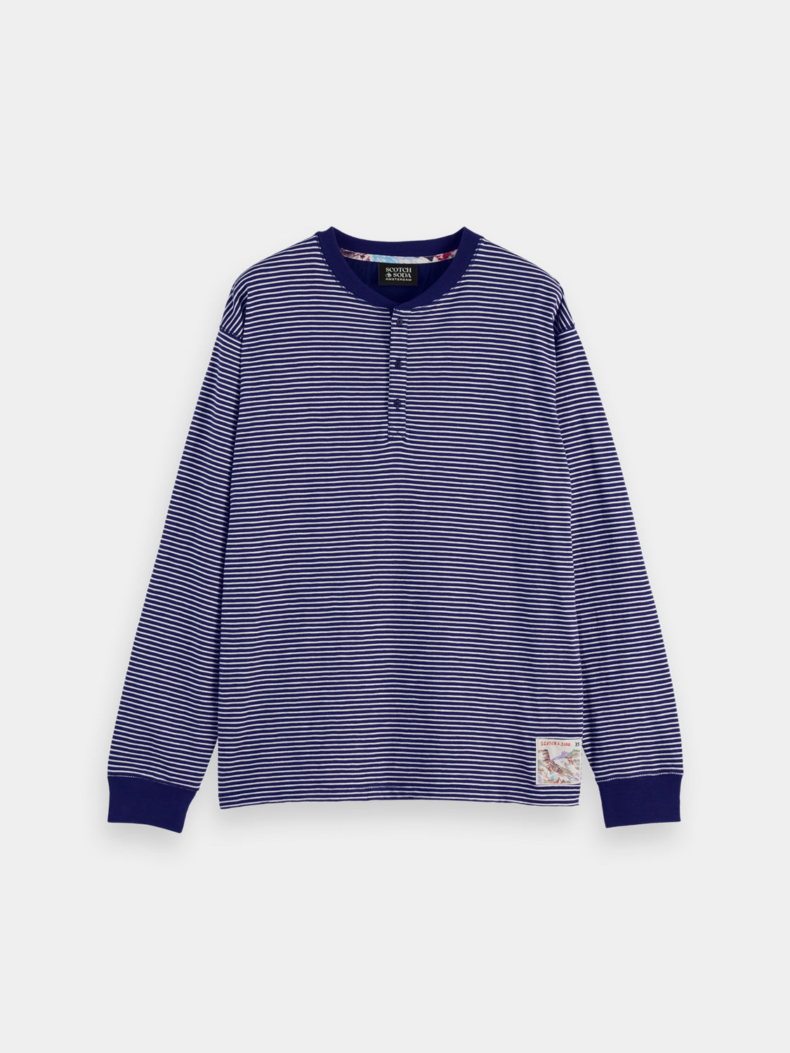 Long sleeve striped Henley t-shirt by Scotch & Soda featuring a classic buttoned neckline and bold horizontal stripes.