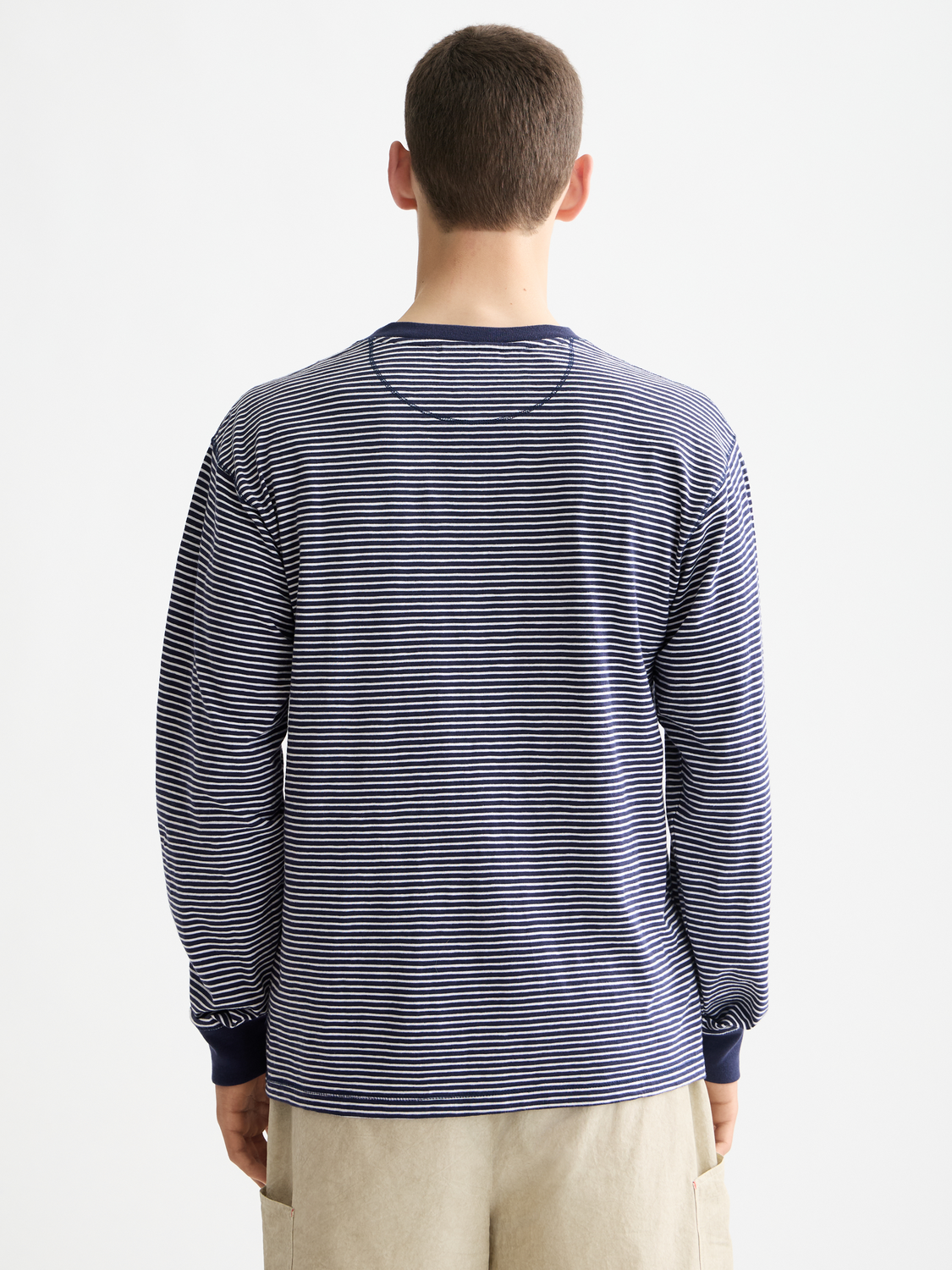 Long-sleeve Scotch & Soda striped Henley t-shirt with buttoned collar, navy and white horizontal stripes, casual fit.