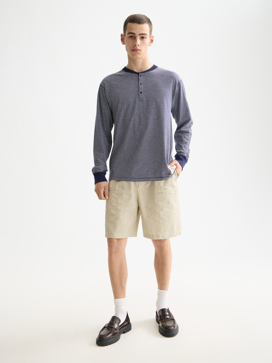 Long sleeve striped Henley t-shirt from Scotch & Soda featuring a classic buttoned neckline and bold stripe pattern.