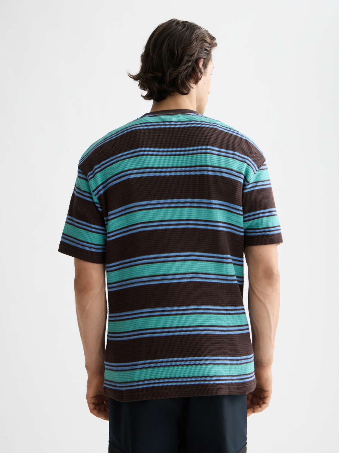 Short-sleeve waffle t-shirt by Scotch & Soda featuring textured fabric and a relaxed fit, shown from the back.