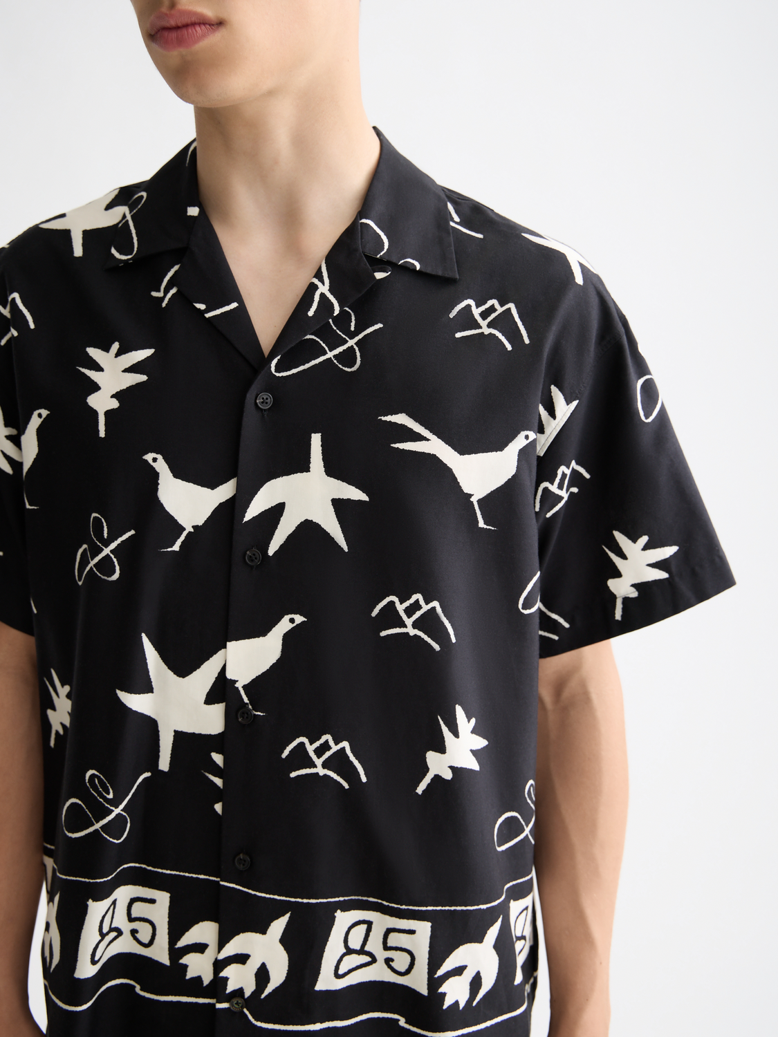 Short-sleeved shirt by Scotch & Soda featuring a stylish design, displayed on a neutral background.