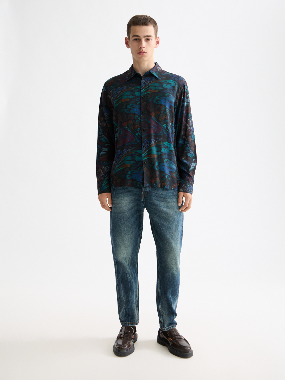 Long-sleeve printed shirt by Scotch & Soda, featuring vibrant patterns and casual fit, displayed on a plain background.
