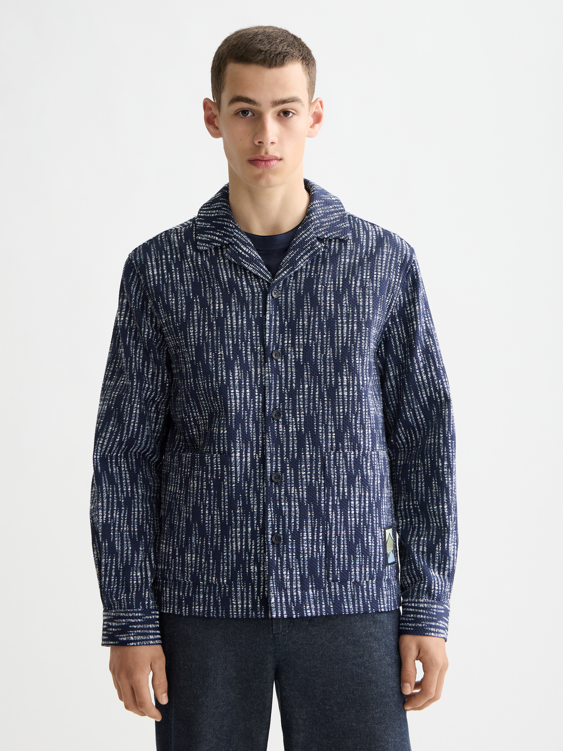 Scotch & Soda jacquard overshirt jacket with intricate woven pattern and button-front design, displayed on a plain background.