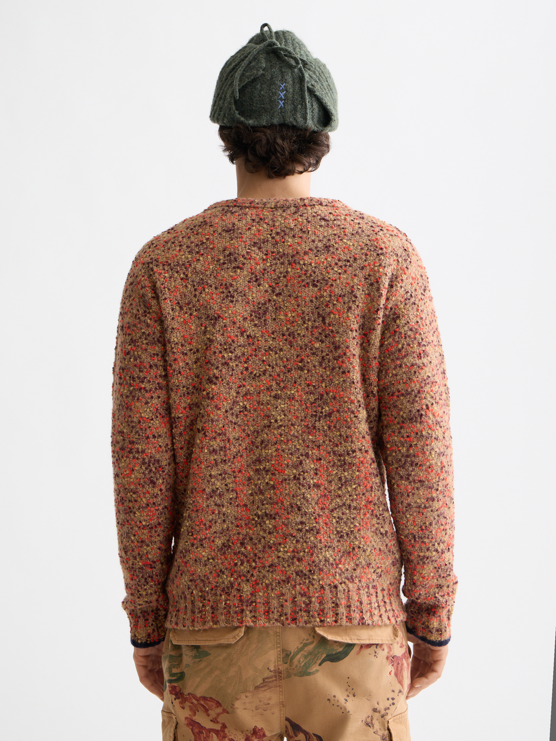 Cream chunky slub knit pullover by Scotch & Soda, showcasing its textured fabric and relaxed fit.