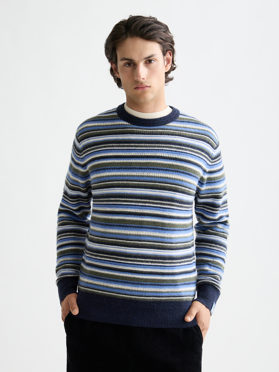 Striped Scotch & Soda knitwear pullover with a crew neck, featuring colorful horizontal stripes and a cozy fit.