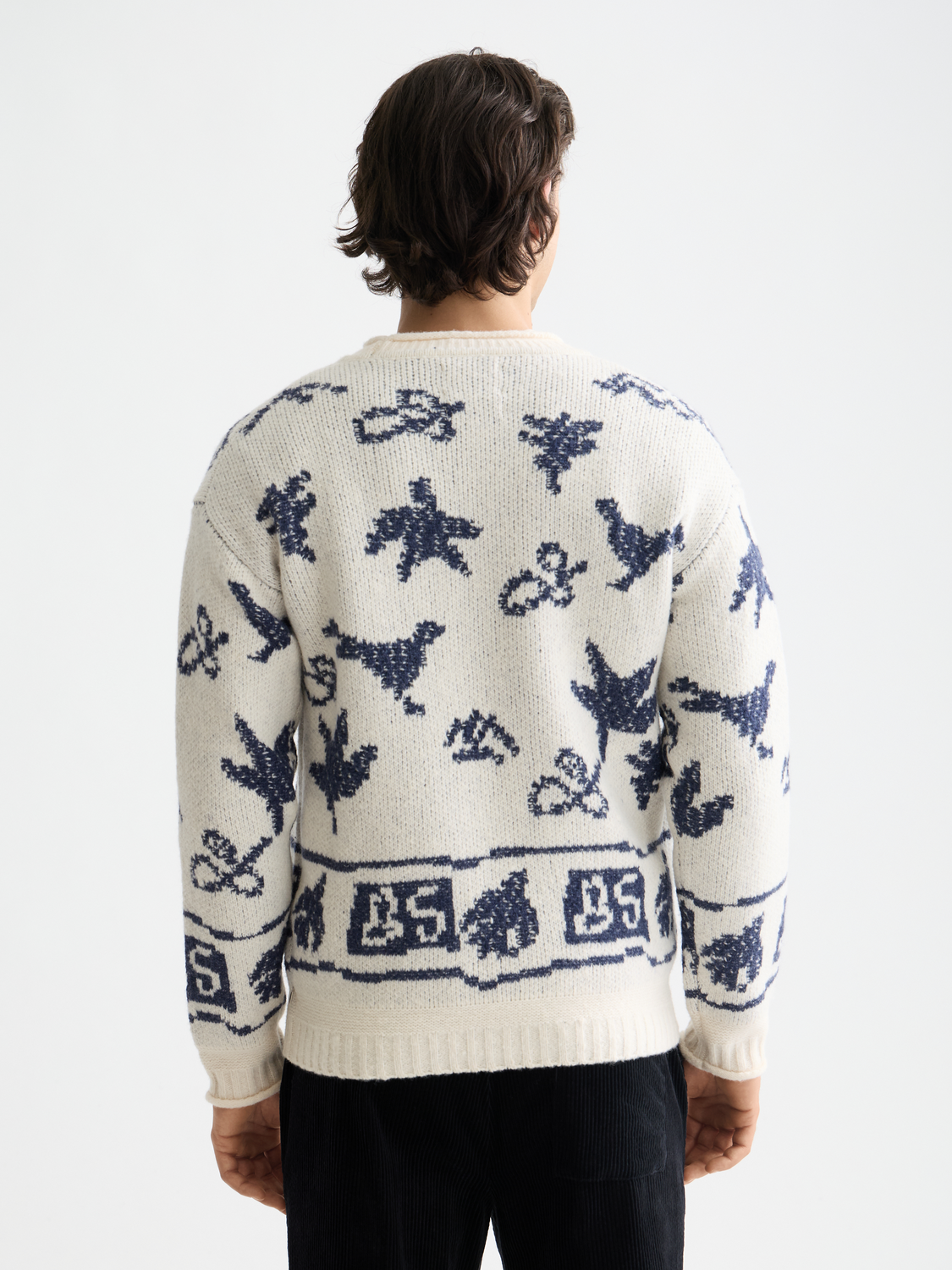SCOTCH & SODA jacquard knitwear pullover with intricate pattern, shown in a close-up view highlighting the fabric texture.