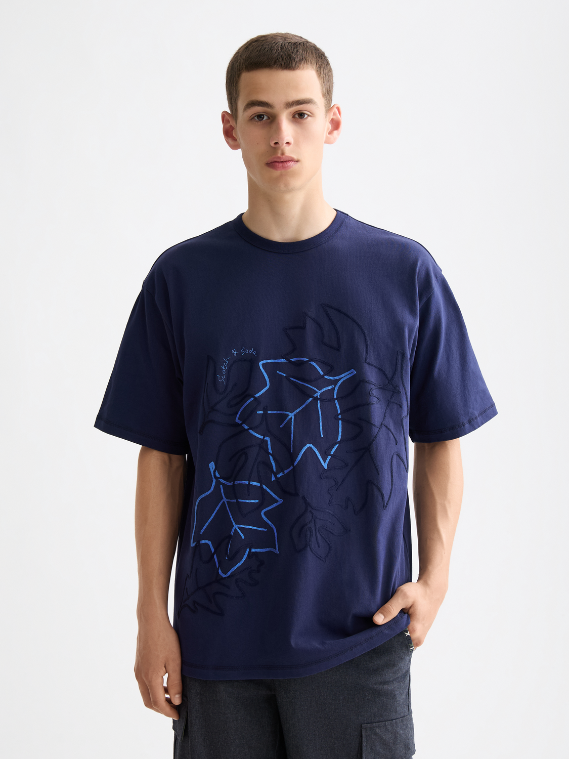 Scotch & Soda embroidered short-sleeve T-shirt with floral design, white fabric, and round neckline.
