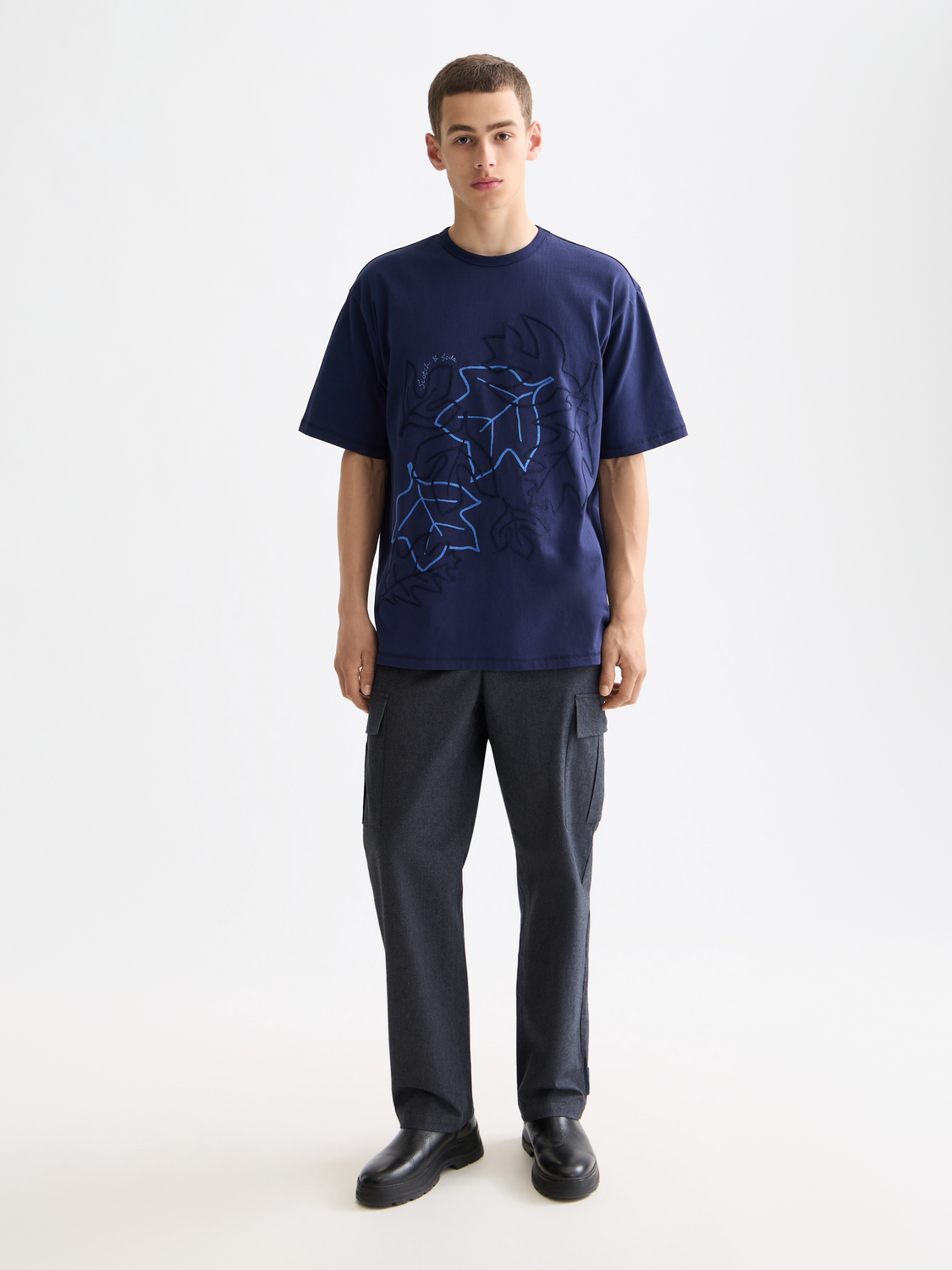 Embossed SCOTCH & SODA embroidered short-sleeve t-shirt with colorful floral design on front.
