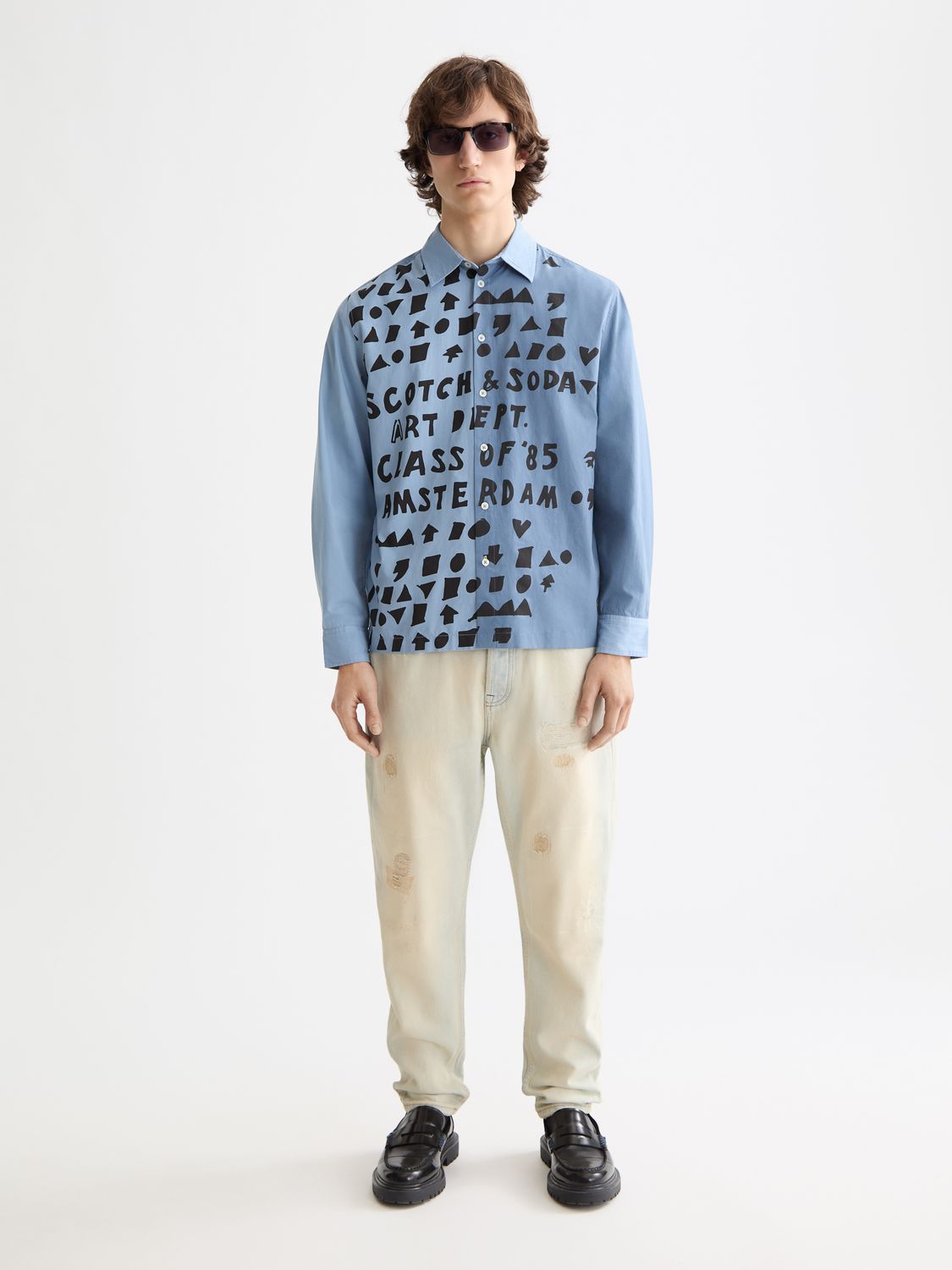 Long-sleeve Scotch & Soda poplin shirt displayed on a model, featuring a classic collar and button-down front.