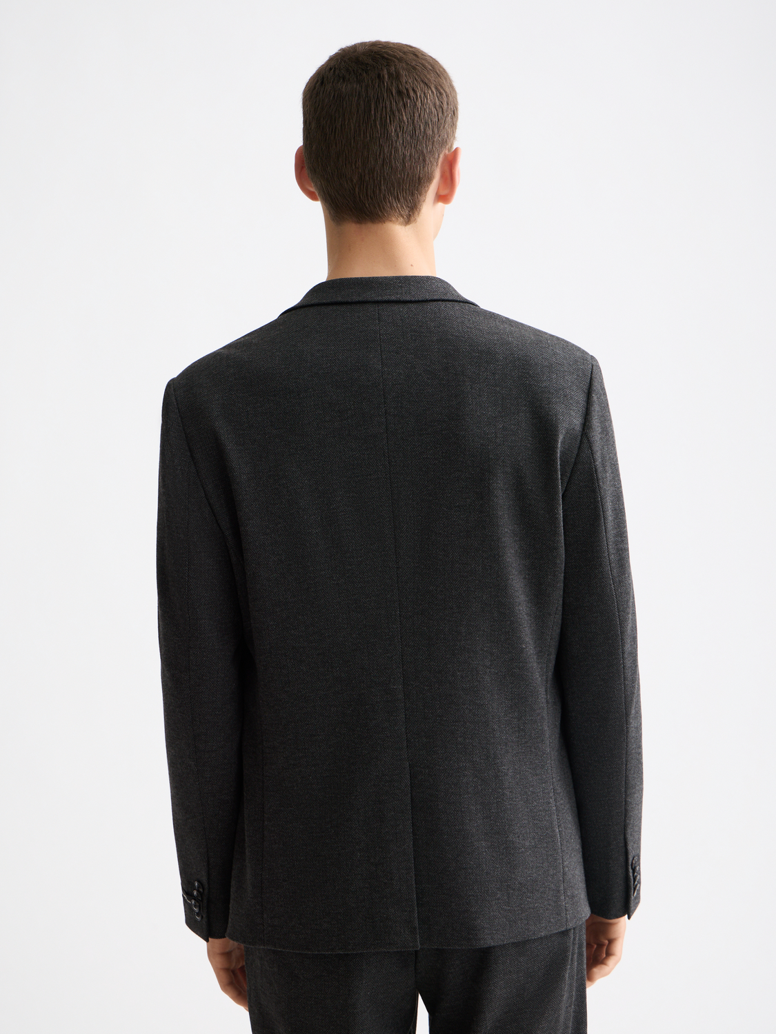 Navy tailored jersey blazer by Scotch & Soda with structured fit and classic lapel, shown from the back.