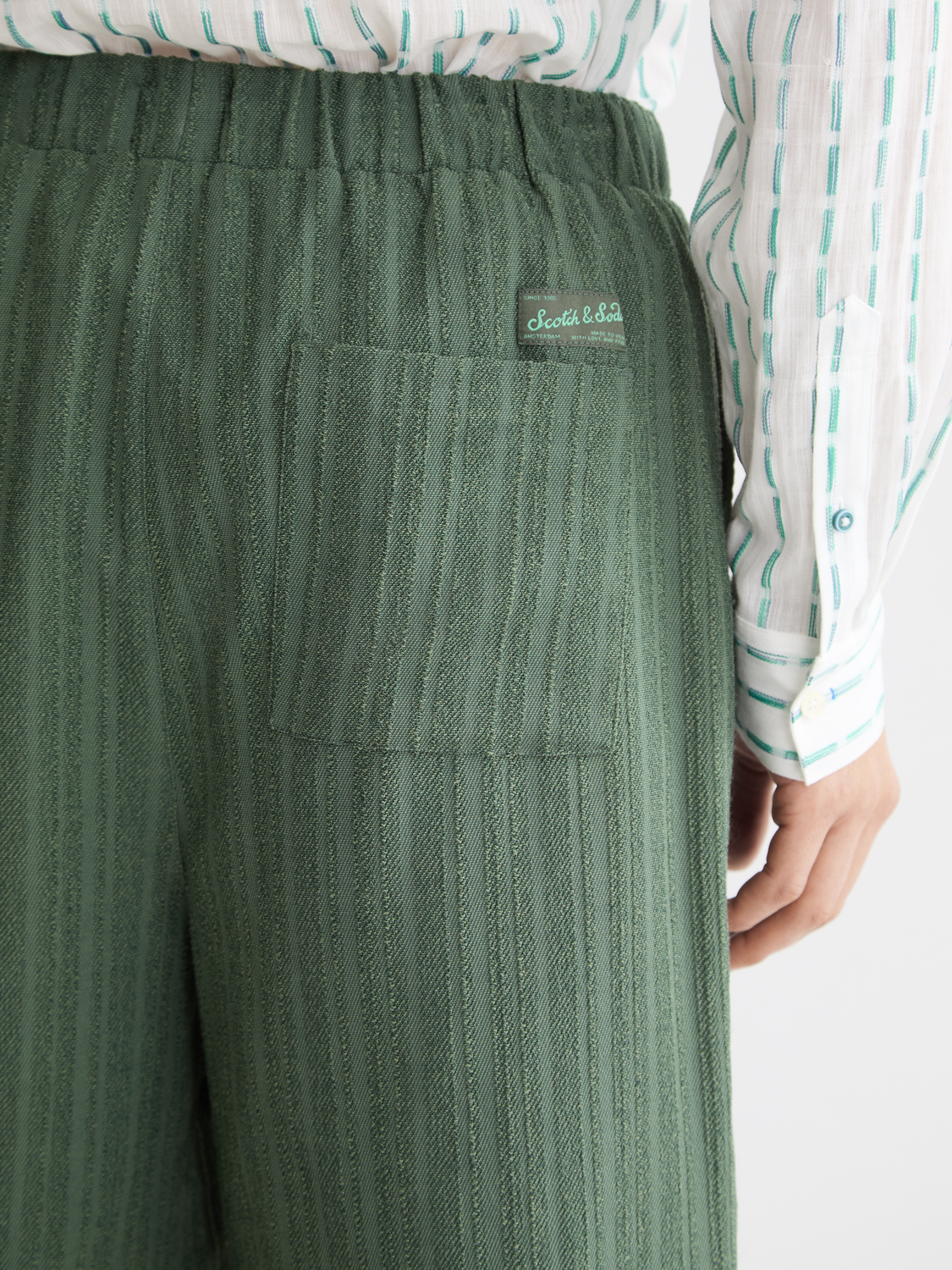 Striped shorts by Scotch & Soda featuring a stylish pattern and casual fit, shown on a model.
