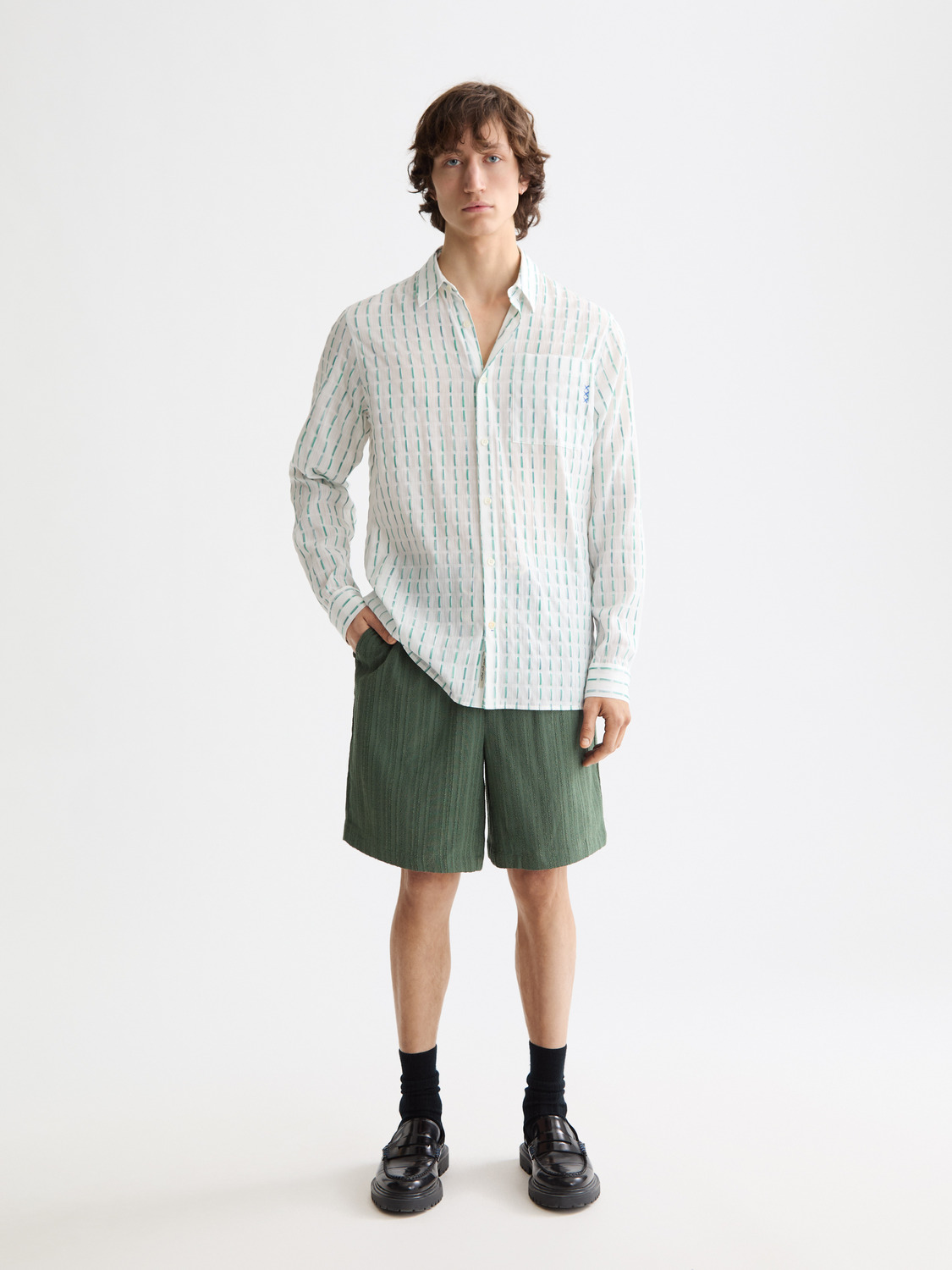 Striped shorts by Scotch & Soda featuring bold pattern and casual fit, displayed on a neutral background.