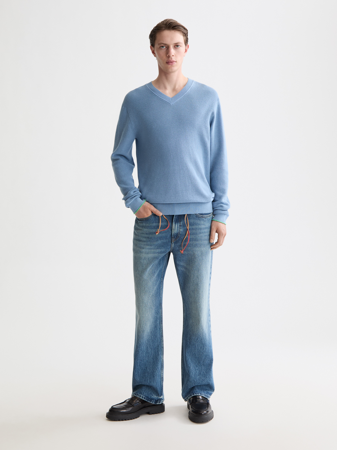 SCOTCH & SODA V-neck knitwear pullover in a classic design, shown in a front view with detailed knit texture.