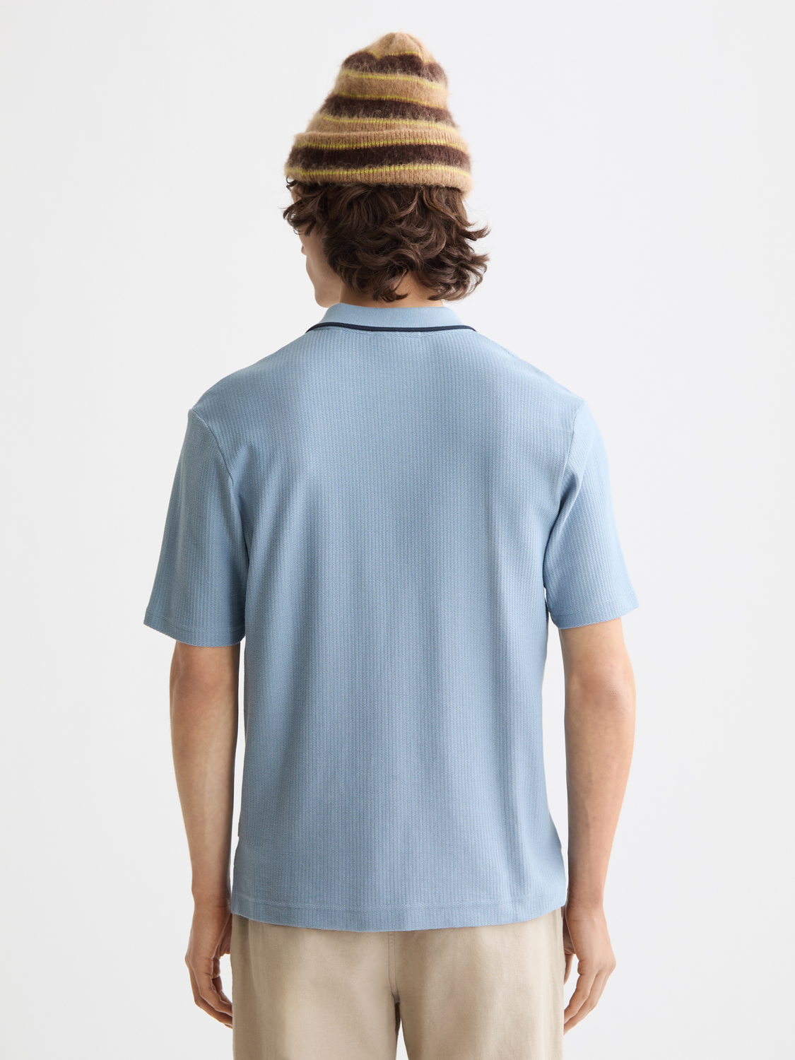 Structured polo shirt by Scotch & Soda, featuring a classic design with a collar and short sleeves, shown from the back.