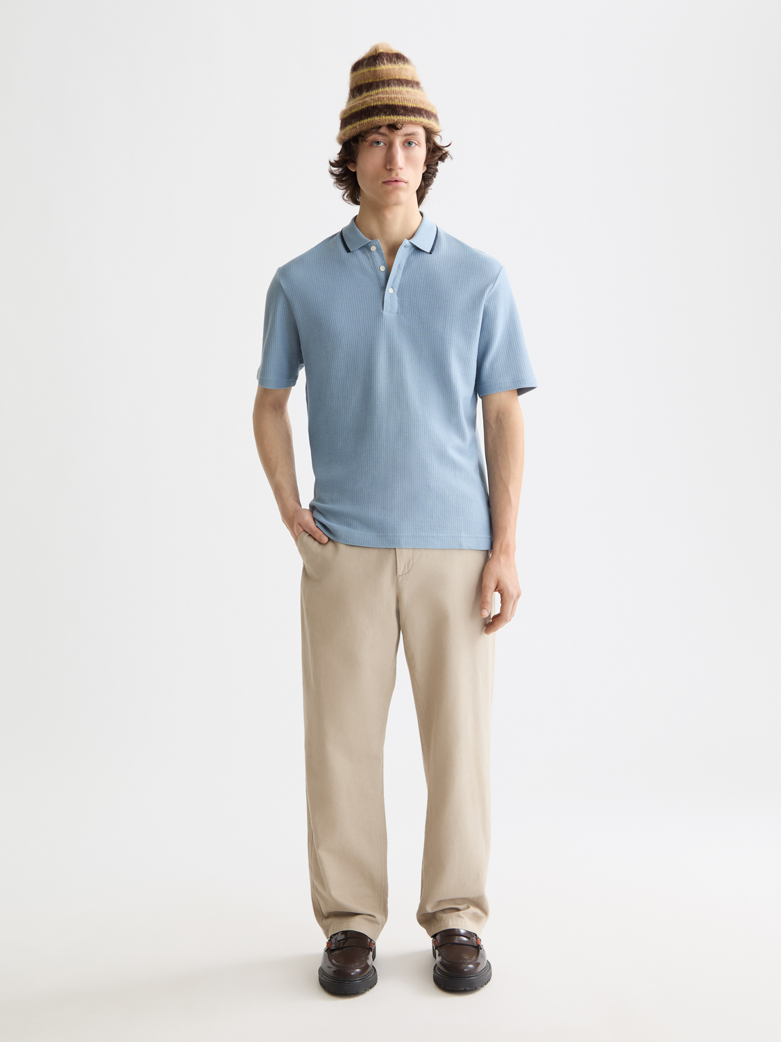 Blue Scotch & Soda structured polo shirt with a classic collar and short sleeves, displayed on a hanger.