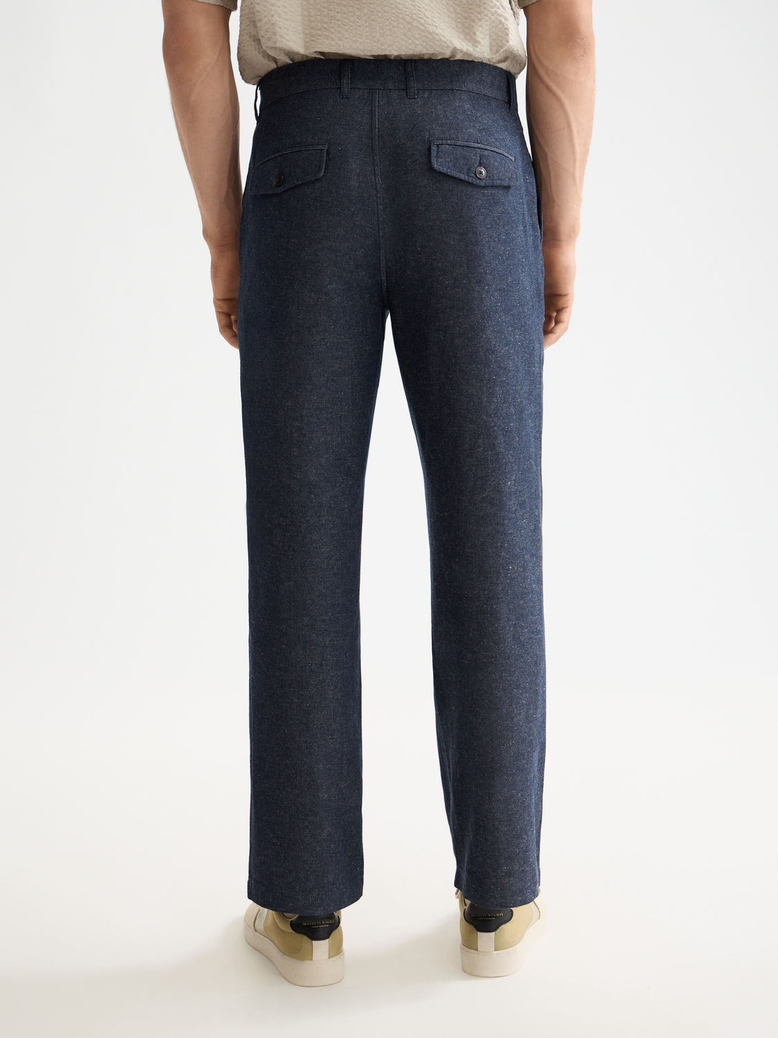 Pair of Scotch & Soda Otis straight-fit chinos in a dark color, shown from the back with a clean, tailored fit.