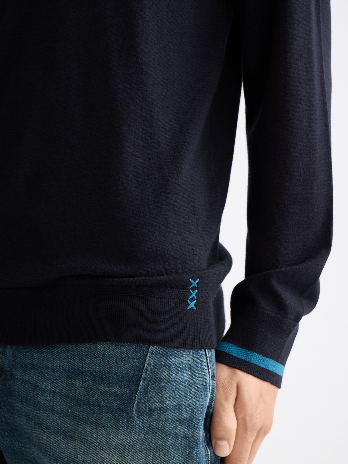 Blue knitted long-sleeved polo shirt by Scotch & Soda, featuring a classic collar and textured knit fabric.