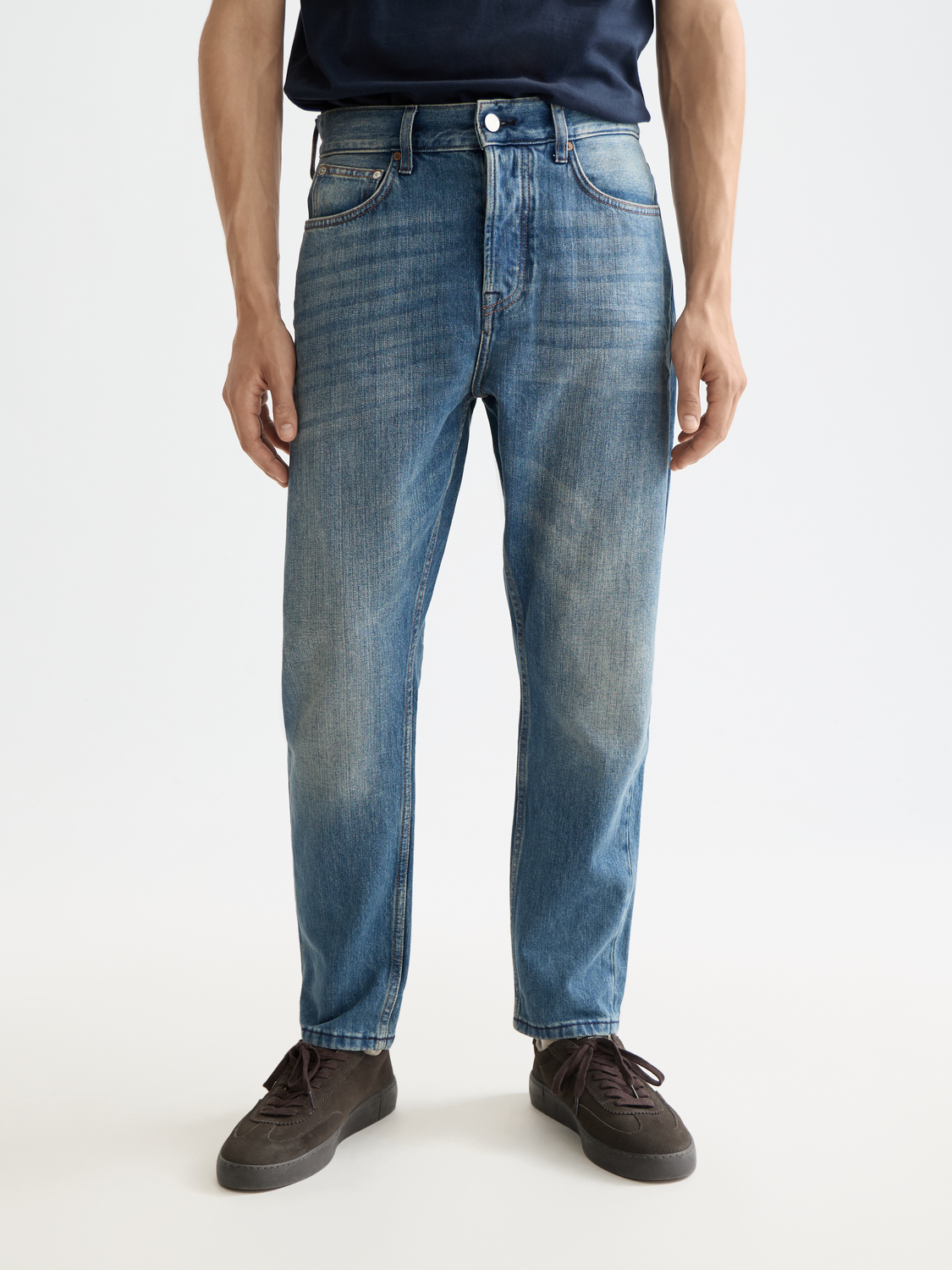 SCOTCH & SODA Dean tapered denim jeans shown in dark wash with classic five-pocket style and slim fit.